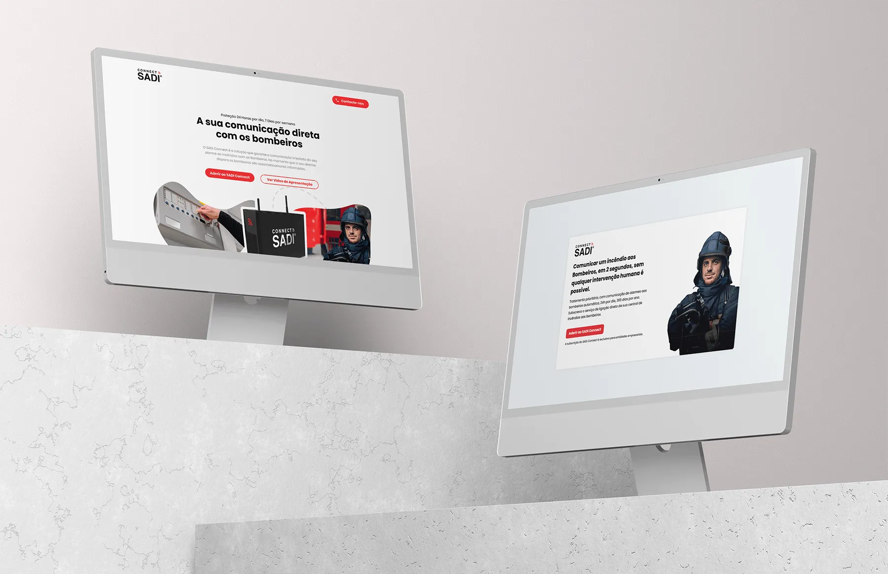 Two monitors displaying the SADI Connect landing page, showing the fire-alarm hardware and a two-second fire-brigade notification feature